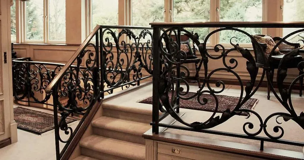 Top landing balustrade. Note: raised platform was formed to allow for racking system on hydraulic lifts for clients walking stick collection!!