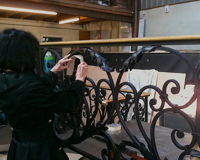 The client adds cardboard acanthus to the “as drawn” balustrades.