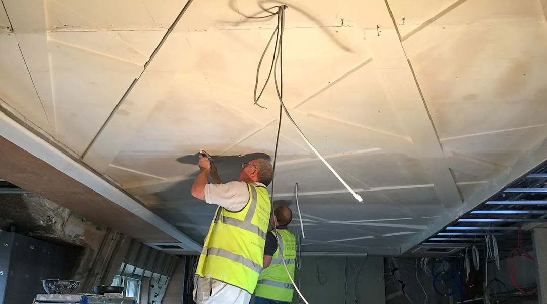 L&R specialists installing and filling the final ceiling. L&R specialists installing and filling the final ceiling.